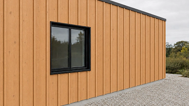 Prefab Building Facade With Wide Timber Boards And Raised Battens